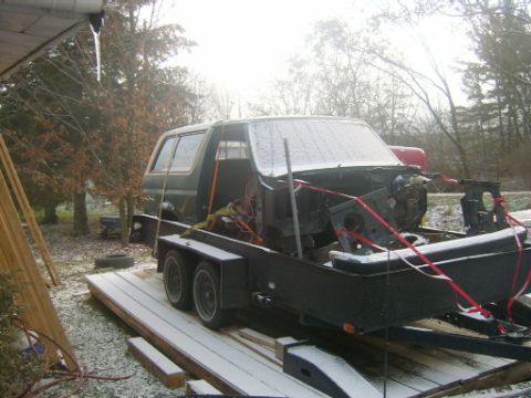 1990 Ford Bronco - This 1990 Ford Bronco is loaded onto a trailer for transport, its front end appears to be disassembled.