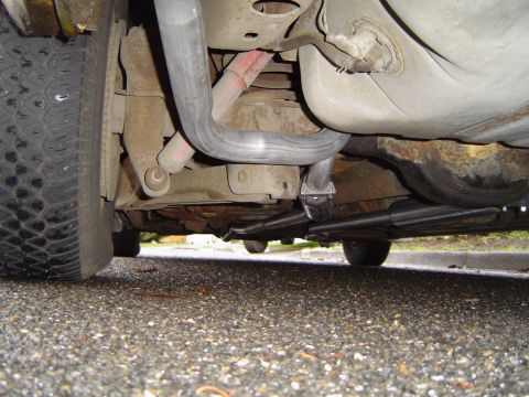 1973 Ford Torino - Close-up view of the undercarriage and exhaust system of a vehicle.