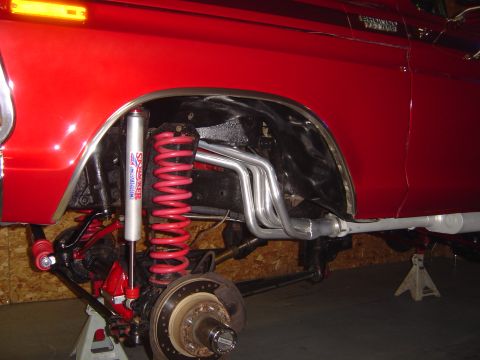 1978 Ford Bronco - Custom suspension and exhaust components are visible on this red 1978 Ford Bronco.