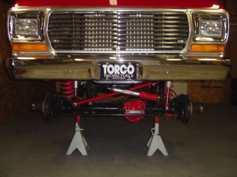 1978 Ford Bronco - Front view of a 1978 Ford Bronco with suspension work, supported by jack stands.