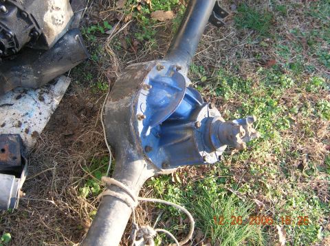 1991 Ford F-150 - A rear axle assembly, likely from a truck, is shown outdoors with a blue differential cover.