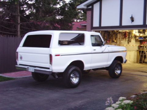 1978 Ford Bronco - This 1978 Ford Bronco is seen from the rear 3/4 angle, parked in a driveway.