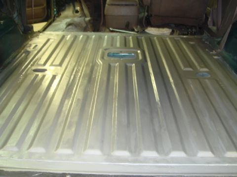 1996 Ford Bronco - The ribbed metal floor of a vehicle's interior, possibly after rust treatment.
