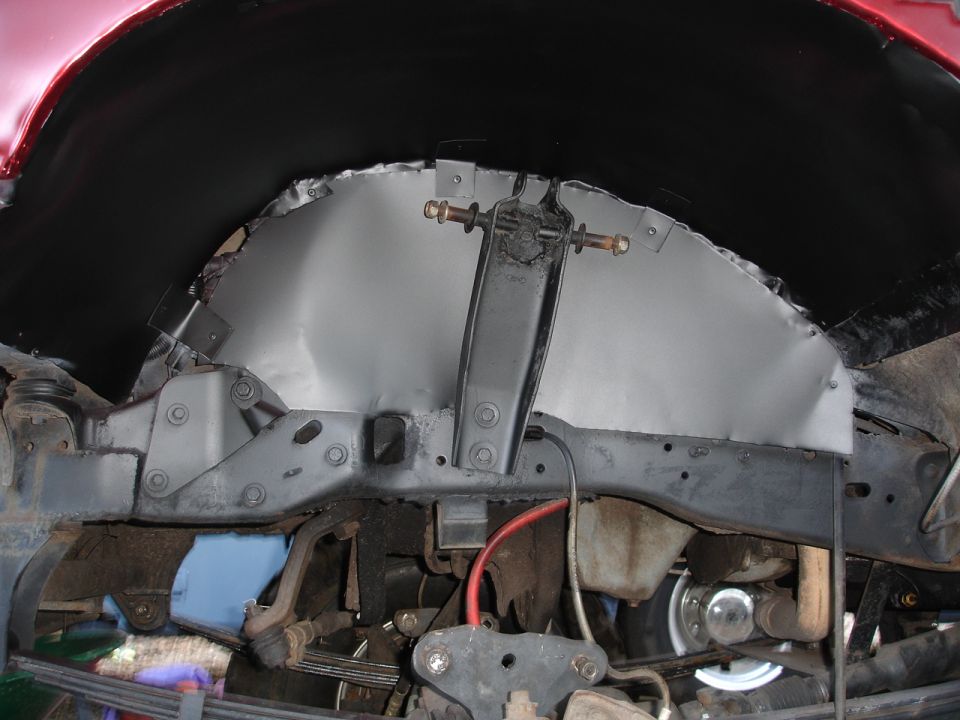 Red 1989 Ford Bronco wheel well repair progress