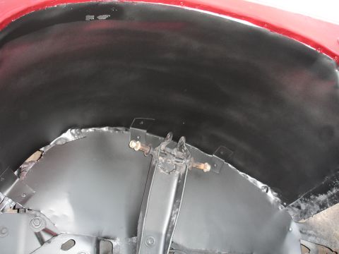 1989 Ford Bronco - Inner wheel well showing metal repair and suspension bracketry.