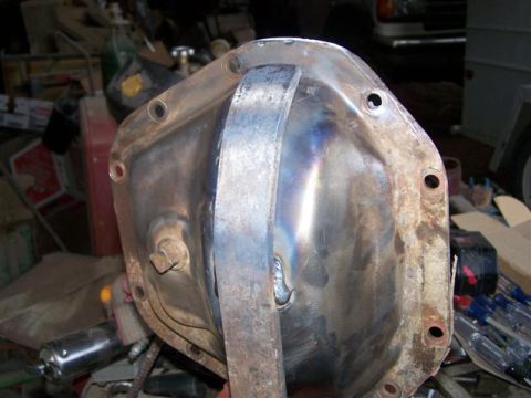 1995 Ford Bronco - A close-up view of a differential cover, likely from a Ford Bronco, with a welded metal plate.