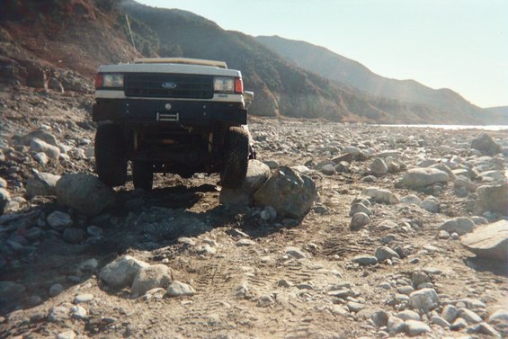White Ford Bronco on rocky terrain