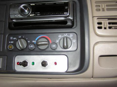 2000 Chevrolet Tahoe - Interior view of a 2000 Chevrolet Tahoe showing the dashboard with climate controls and aftermarket switches.