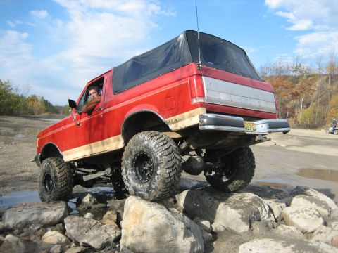 1990 Ford Bronco - This 1990 Ford Bronco is navigating a rocky obstacle on an off-road course.