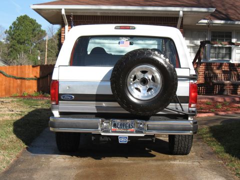 1994 Ford Bronco - Rear view of a 1994 Ford Bronco, its spare tire and a custom license plate.
