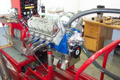 1978 Ford F-250 - Engine on a test stand with visible exhaust headers and chrome valve covers.