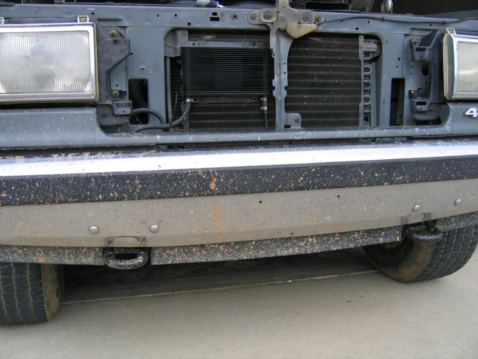 Truck front end with a tow hook and dirty bumper