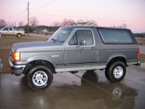 1989 Ford Bronco - This gray 1989 Ford Bronco features a two-tone paint scheme with a black removable top.