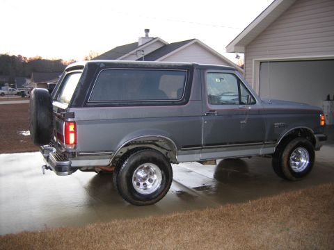 1989 Ford Bronco - This 1989 Ford Bronco is shown from the side, its iconic spare tire mounted on the rear.