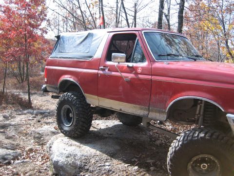 1990 Ford Bronco - This lifted 1990 Ford Bronco navigates a rocky trail during an off-road excursion.