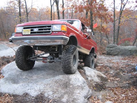 1990 Ford Bronco - This lifted 1990 Ford Bronco navigates a rocky trail during an off-road excursion.