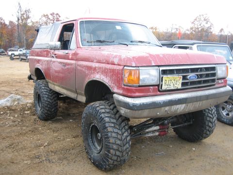 1990 Ford Bronco - This lifted Ford Bronco is ready for off-road adventures, with its large tires and appearance.