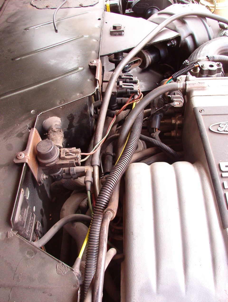 All of these secondary air controls are useless without the air pump, but I'm glad he didn't rip them out.

He did use the correct vacuum port for the brake booster, but not for the A/C controls.