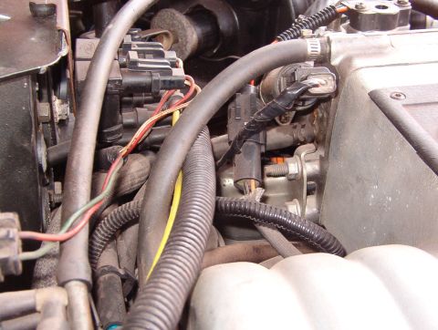 1975 Ford Bronco - This & the next photo show how I flipped the IAC by rearranging the throttle heater nipples so the brake MC/power booster would fit.