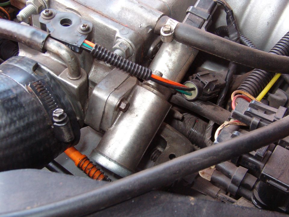 This & the previous photo show how I flipped the IAC by rearranging the throttle heater nipples so the brake MC/power booster would fit.