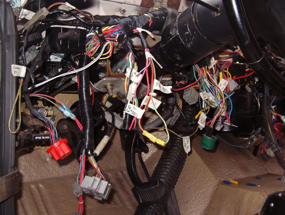 The big red connector is for the interval wipers (module is at the top).  Just to its R, the white plastic tube on the black wire is for the ammeter.  The big plastic harness holder above the column is only temporary - it's too big to fit behind the dash.