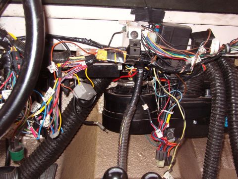 1975 Ford Bronco - I've made the center dash brace my main ground, but there are other redundant grounds. The big harness going down by the t-case shifters is…