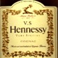 1997 Ford Crown Victoria - A close-up of a Hennessy V.S. Cognac label, ornate gold detailing.