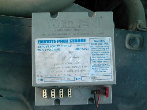 1986 Ford Bronco - Close-up of a Whelen Remote Pack Strobe power supply unit, showing its label and wiring terminals.