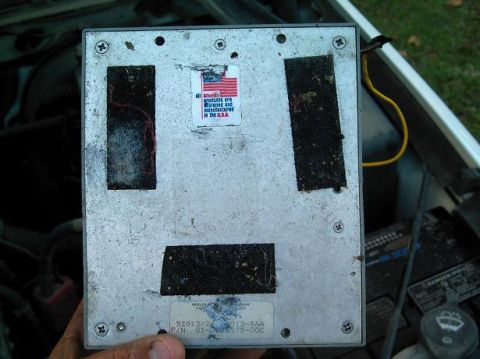 1986 Ford Bronco - Close-up of an electronic control module, likely from a vehicle, with visible part numbers and a US-made sticker.