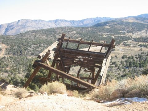 2000 Jeep Cherokee - An old, decaying wooden structure stands precariously on a hillside overlooking a valley.