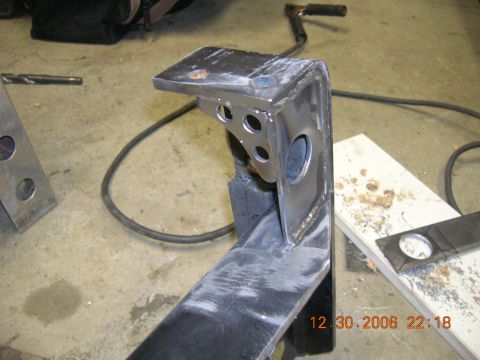 1996 Ford Bronco - This photo shows a fabricated metal bracket, likely part of a custom bumper assembly, with welding equipment nearby.