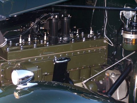 1990 Ford Bronco - Close-up view of an engine compartment, showing mechanical components and wiring.