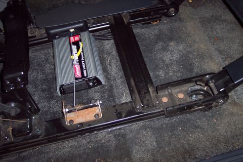 2002 Chevrolet Suburban - A Coleman Powermate 400 watt power inverter is visible mounted beneath the vehicle's seat.