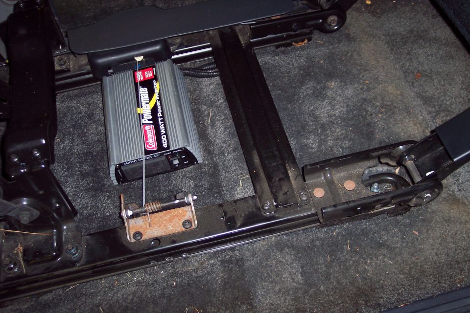 Coleman Powermate 400 watt power inverter mounted under vehicle seat