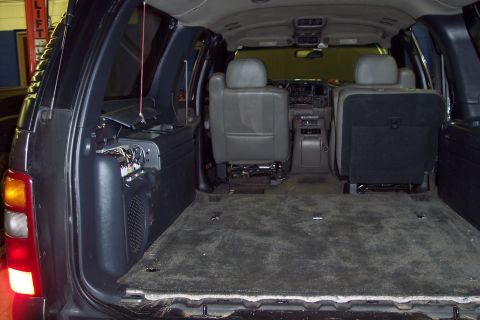 2002 Chevrolet Suburban - Interior view of a 2002 Chevrolet Suburban, showing the cargo area and second-row seating.