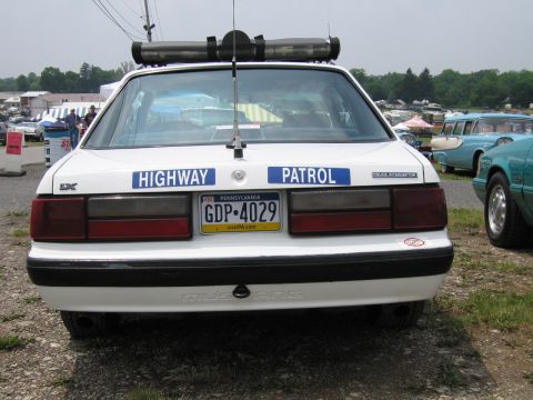 1991 Ford LTD Crown Victoria - Rear view of a white Ford Mustang LX police car lettered Highway Patrol with a Pennsylvania license plate reading GDP-4029 and a roof light…