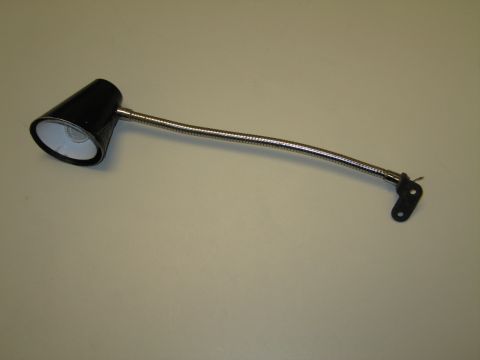 1991 Ford LTD Crown Victoria - Black flexible gooseneck reading or work lamp with chrome neck and bracket mount lying on a tan surface.