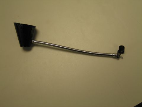 1991 Ford LTD Crown Victoria - Black conical-shade gooseneck lamp with a chrome flexible neck and small mounting bracket on a tan surface.