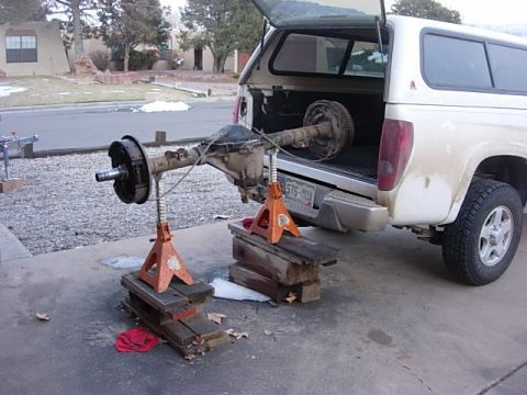 1987 Ford Bronco - how to load a 14 bolt by yourself with no hoist. with the brake drums and axles out it is not that heavy. so get it up on a ton of wood, in…