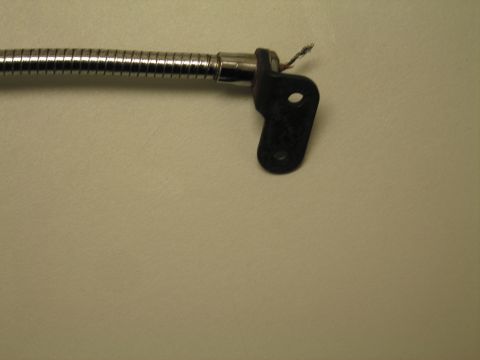 1991 Ford LTD Crown Victoria - Close-up of a chrome gooseneck flexible neck ending in a black two-hole mounting bracket on a tan surface.