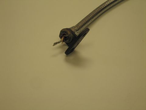 1991 Ford LTD Crown Victoria - Detail of the mounting-bracket end of a flexible chrome gooseneck lamp, showing the exposed frayed wire and pivot base.