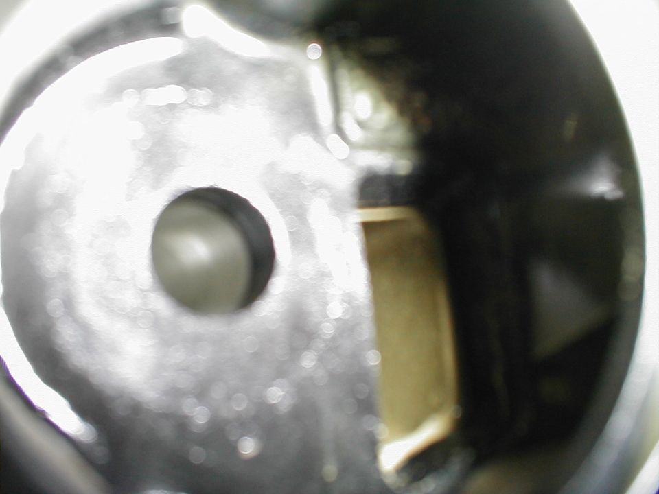 Engine intake manifold opening with Supermotors logo