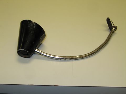 1991 Ford LTD Crown Victoria - flexible chrome gooseneck lamp with a black bell-shaped metal shade and a spring-clip mounting end on a tabletop.