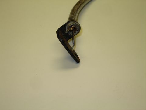 1991 Ford LTD Crown Victoria - Detail of the curved spring-clip mounting end and wiring at the base of a flexible chrome gooseneck lamp.