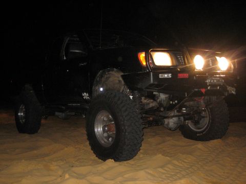 1989 Ford Bronco - This modified pickup truck is equipped for off-road adventures, large tires and powerful lighting for nighttime use.