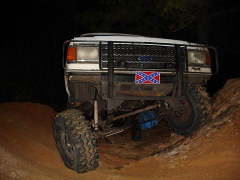 1989 Ford Bronco - This 1989 Ford Bronco is equipped with a heavy-duty push bar and a prominent Confederate flag sticker on the grille.