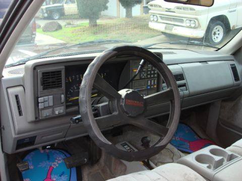 1983 Ford Bronco - a full shot of the dash and manual transfer case shifter.