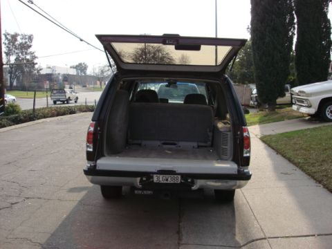 1983 Ford Bronco - the rear is a tailgate glass and tailgate. the full size spare is on the inside of the cargo area.
