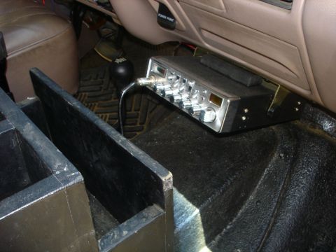 1996 Ford Bronco - The CB is mounted under the dash. The block is wedged in on top to keep it at that angle so it doesnt interfere when you open the ash tray.