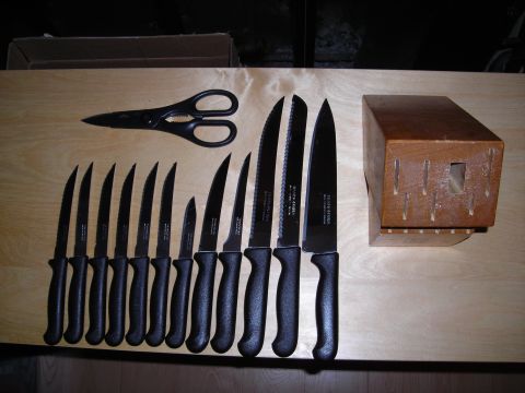 2003 Jeep TJ - A collection of kitchen knives and shears is neatly arranged next to a wooden knife block.